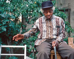Photograph of an older man sittign